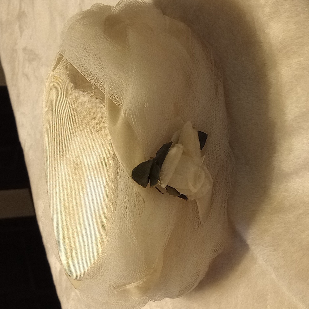 Cream colored vintage hat with rose